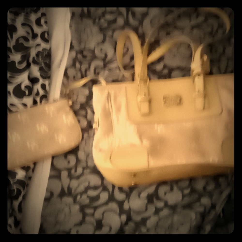 Dooney and Bourke tan purse with bonus makeup bag
